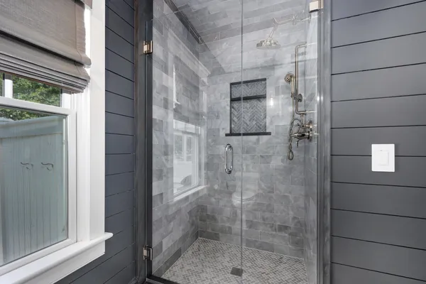 a bed room with a bed and a window