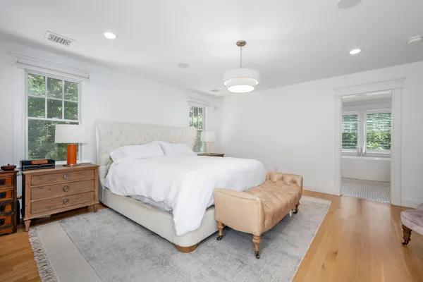 a bed room with a bed and a window