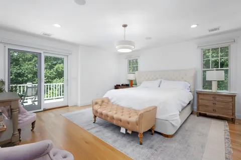 a bed room with a bed and a window