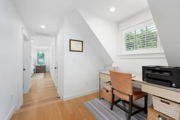 a spacious bathroom with a double vanity sink a mirror and a bathtub