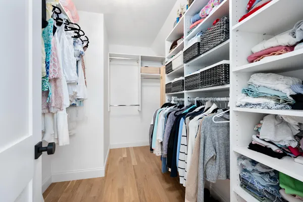 a bathroom with a double vanity sink toilet and a mirror
