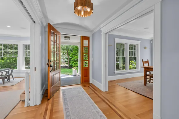a very nice looking room with a large window and a rug