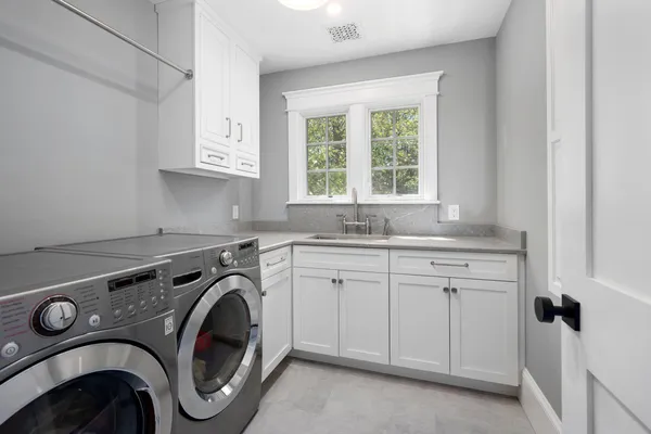 an empty room with large area and wooden floor