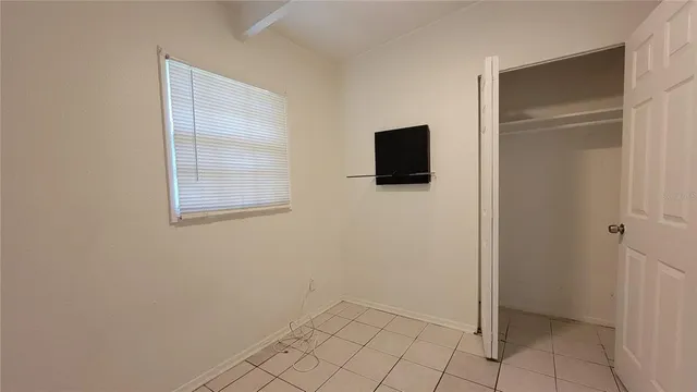 a bathroom with a sink mirror and toilet
