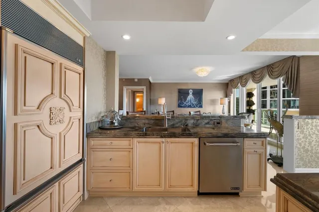 a kitchen with sink and cabinets