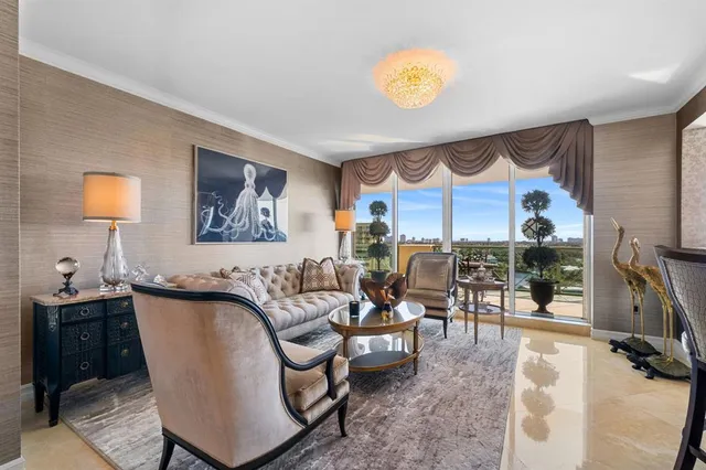 a living room with furniture a rug and a flat screen tv