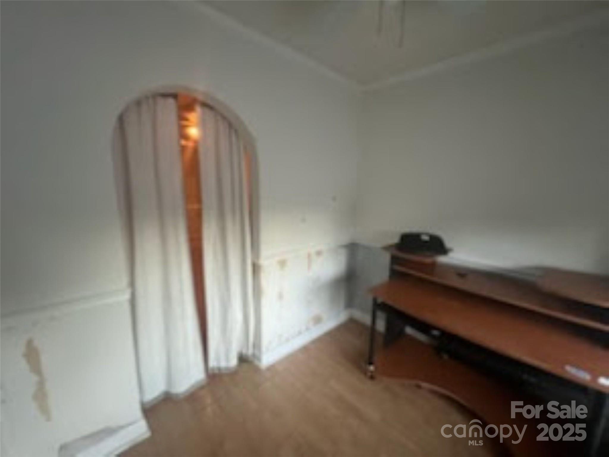 453 Marion Street Calhoun Falls, SC 29628 - Photo 16 of 24 a room with a piano and wooden floor