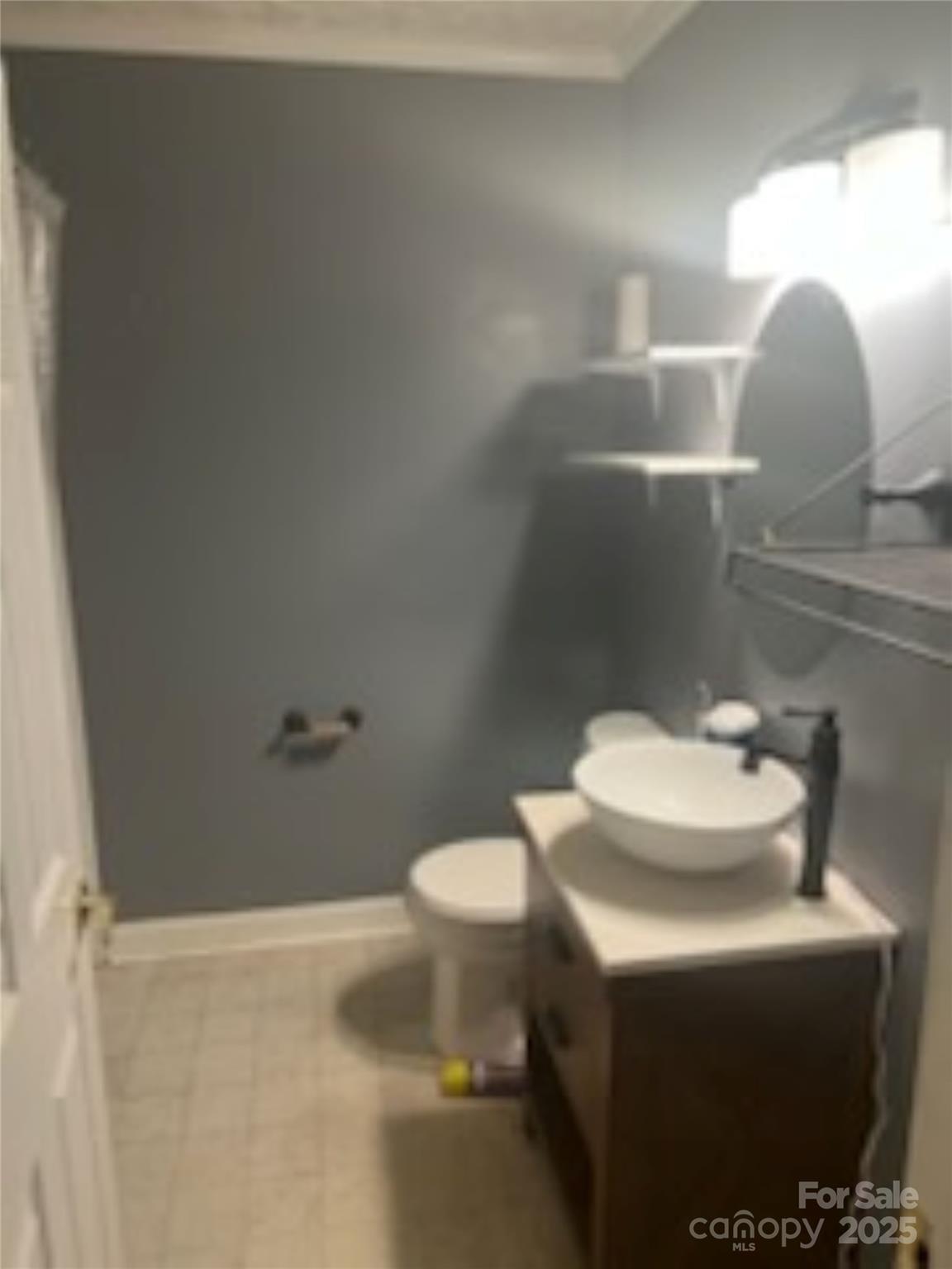 453 Marion Street Calhoun Falls, SC 29628 - Photo 5 of 24 a bathroom with a sink and a mirror