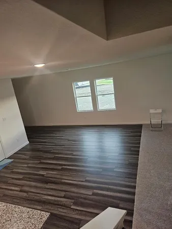 a view of room with window and stairs