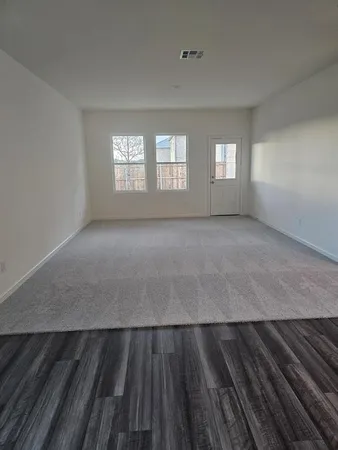 a view of an empty room and window