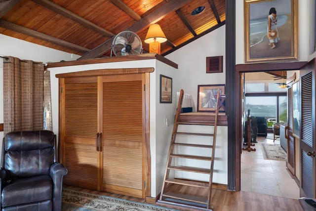 a view of entryway with wooden floor and stairs