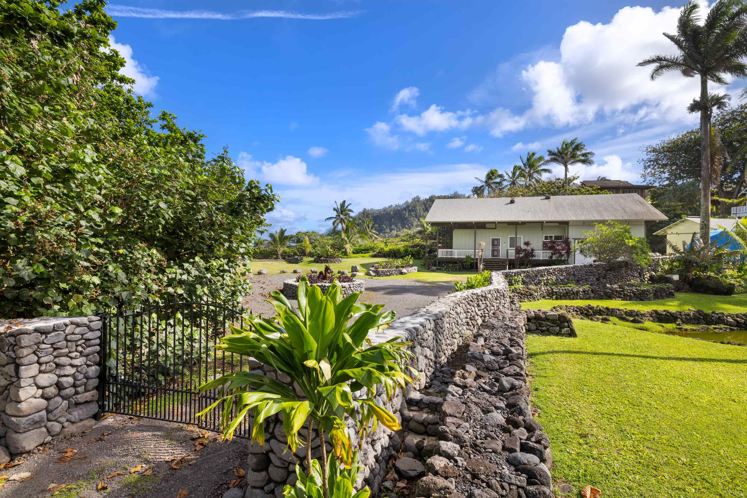 140 Waikoloa Road Hana, HI 96713 - Photo 17 of 32 a view of a swimming pool with a patio
