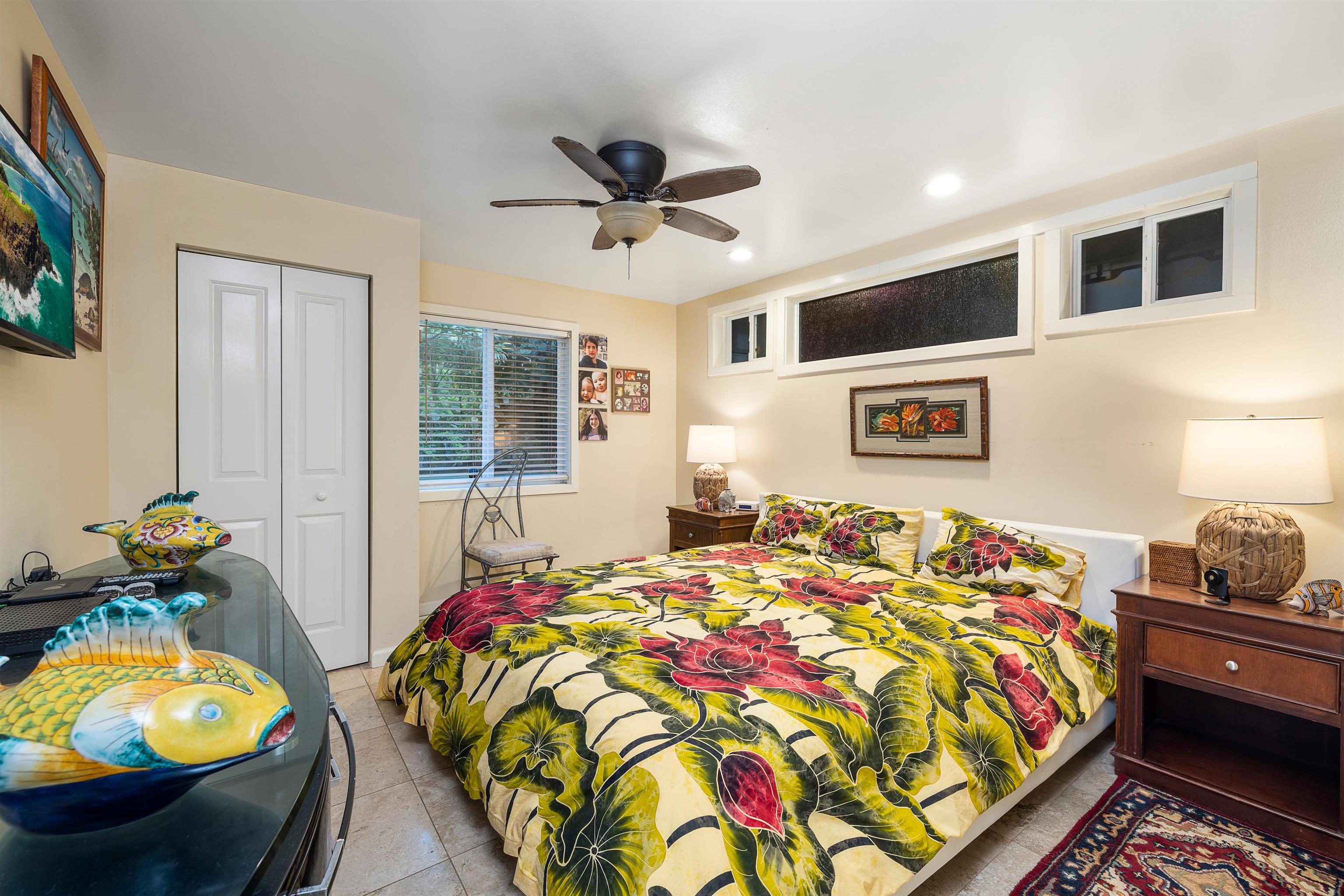 140 Waikoloa Road Hana, HI 96713 - Photo 18 of 32 a bed sitting in a bedroom next to a window