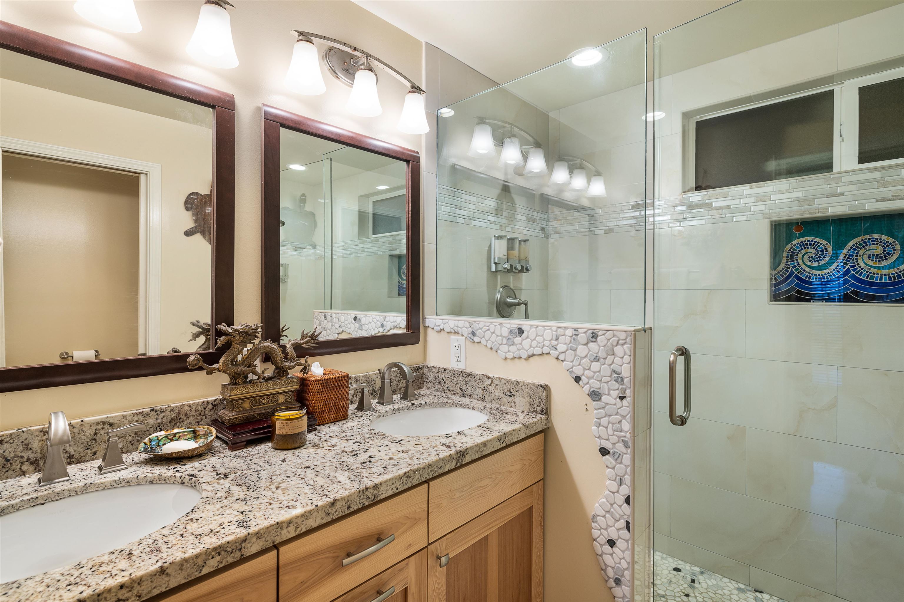 140 Waikoloa Road Hana, HI 96713 - Photo 25 of 32 a bathroom with a granite countertop sink a large mirror and shower