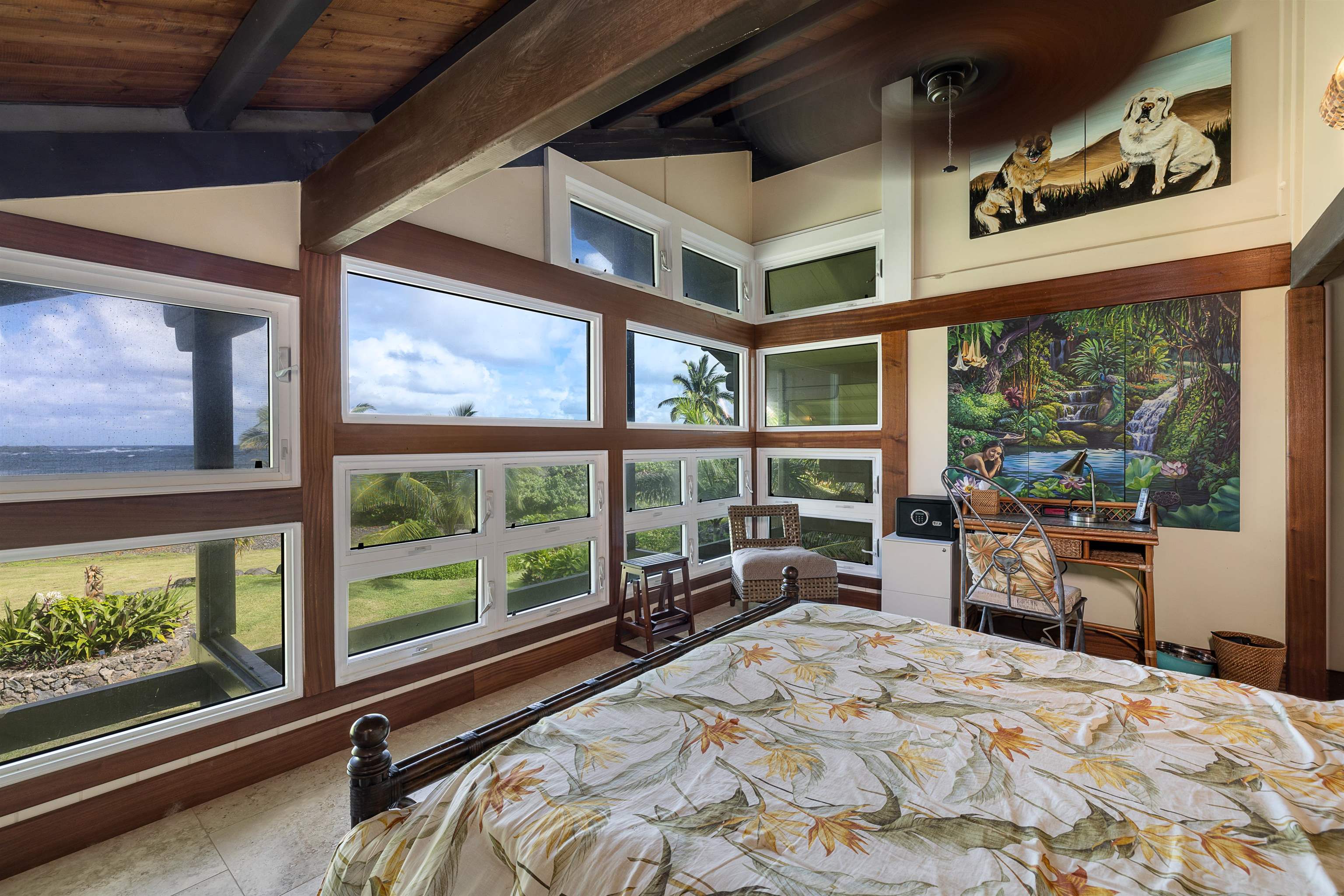 140 Waikoloa Road Hana, HI 96713 - Photo 5 of 32 a bed sitting in a bedroom next to a large window