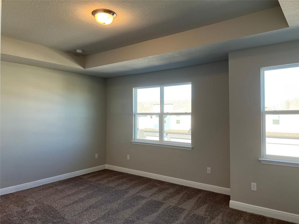 2232 Shadowland Loop Winter Park, FL 32792 - Photo 11 of 12 an empty room with wooden floor and windows