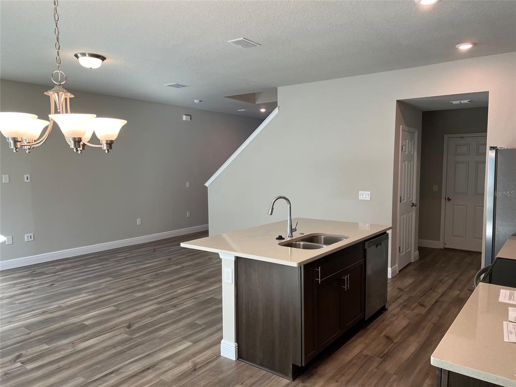 2232 Shadowland Loop Winter Park, FL 32792 - Photo 5 of 12 a kitchen with a sink and chandelier