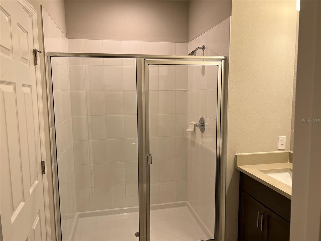 2232 Shadowland Loop Winter Park, FL 32792 - Photo 10 of 12 a bathroom with a shower and a sink