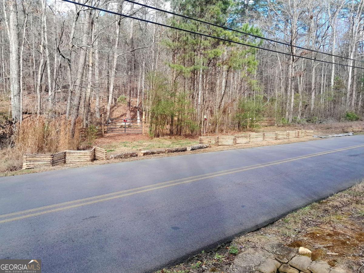 0 East Hermitage Road Northeast, Unit LOT 6 Rome, GA 30161 - Photo 44 of 44 a view of a road with a barn in the background