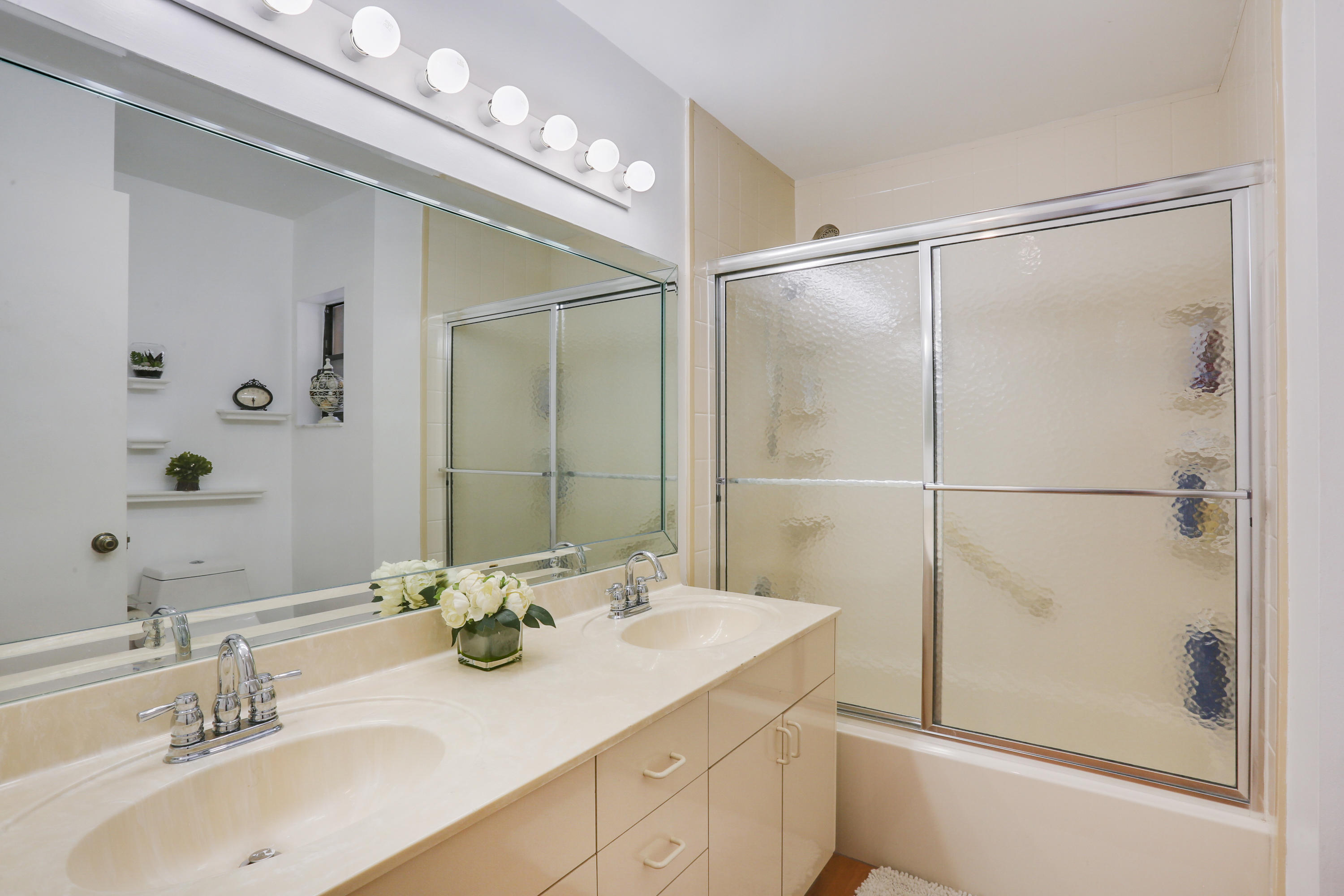 11402 Country Sound Court Boca Raton, FL 33428 - Photo 13 of 22 a bathroom with a double vanity sink mirror and shower
