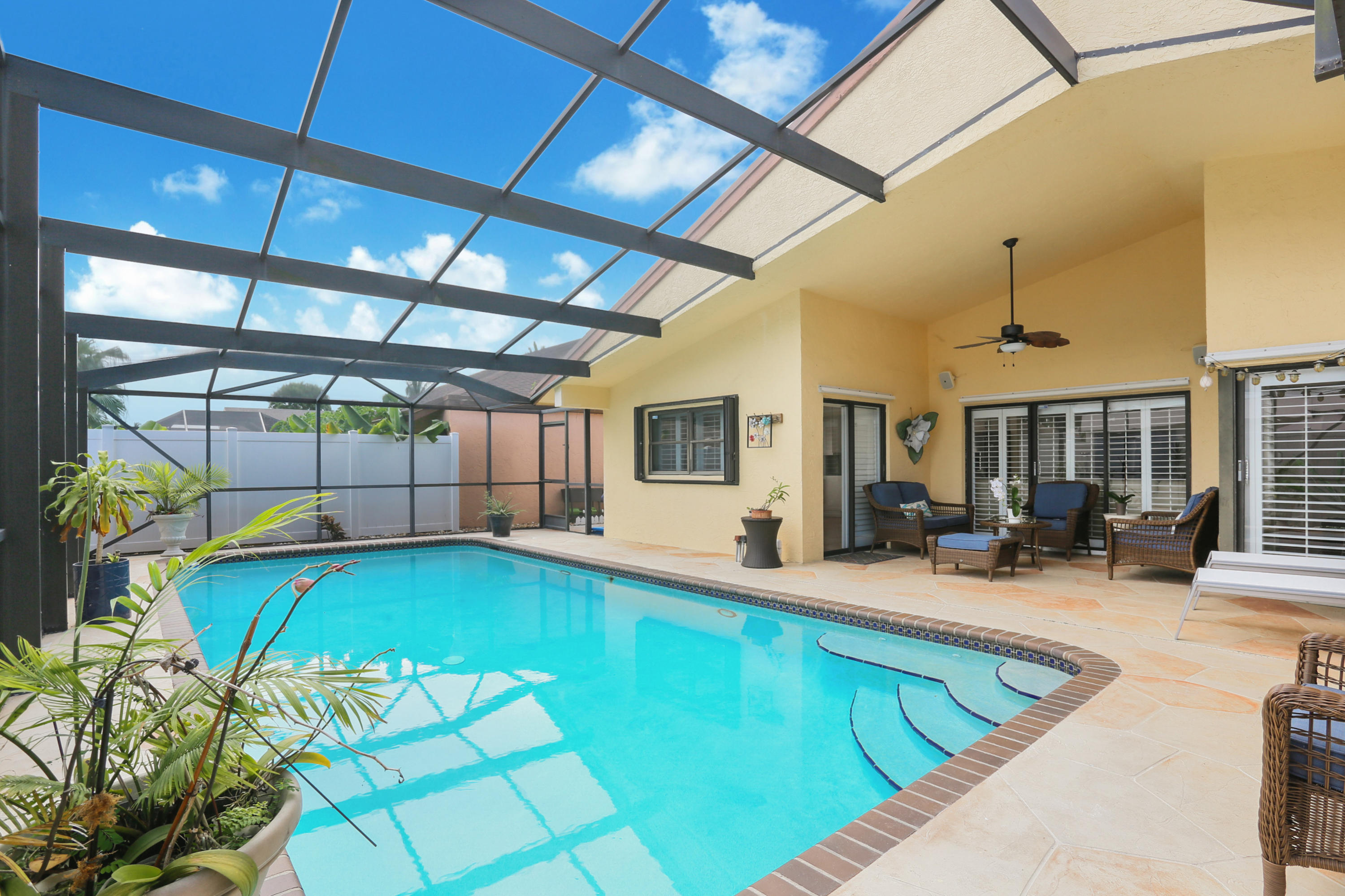 11402 Country Sound Court Boca Raton, FL 33428 - Photo 15 of 22 a view of a house with swimming pool