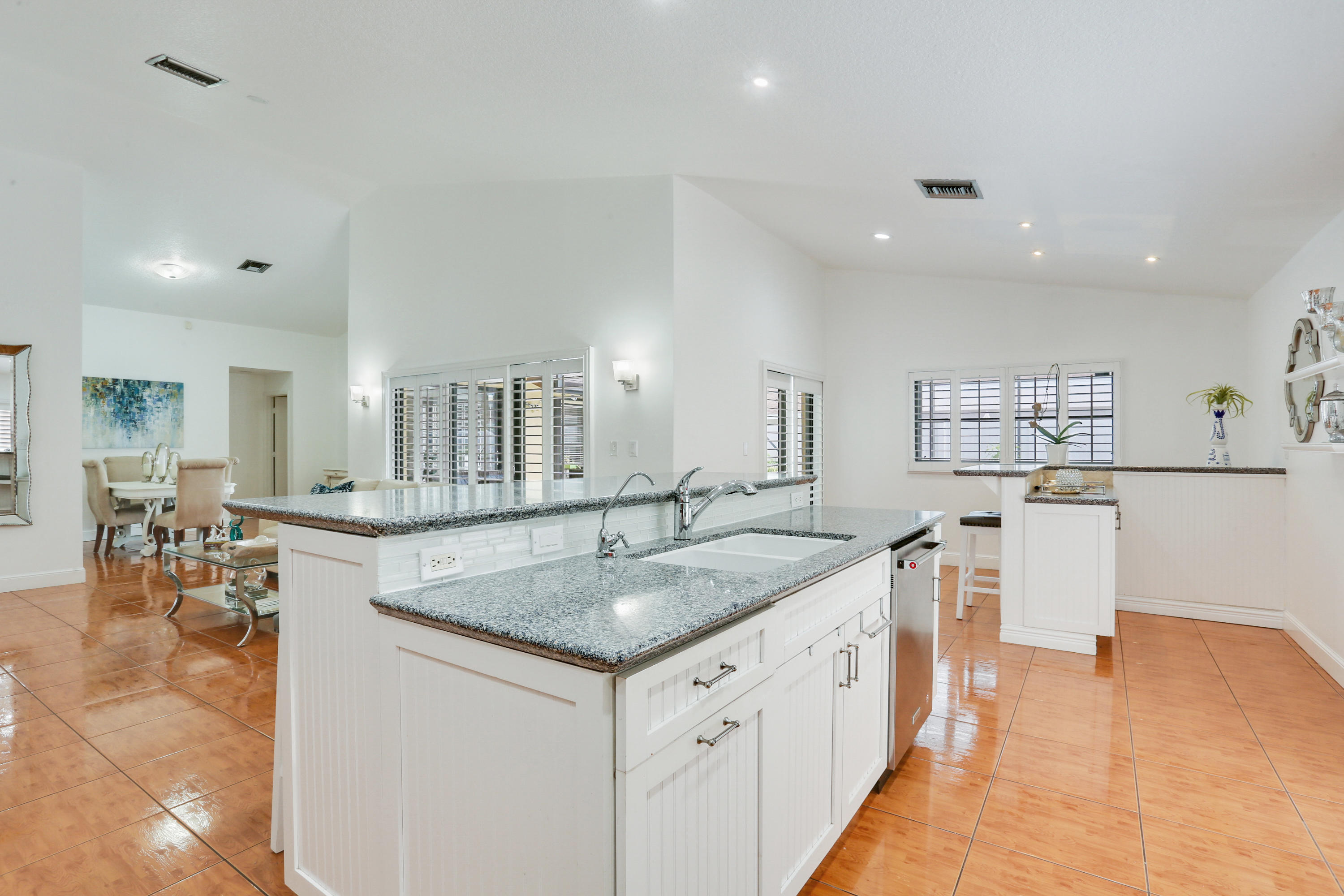 11402 Country Sound Court Boca Raton, FL 33428 - Photo 5 of 22 a kitchen with stainless steel appliances granite countertop a sink and a refrigerator