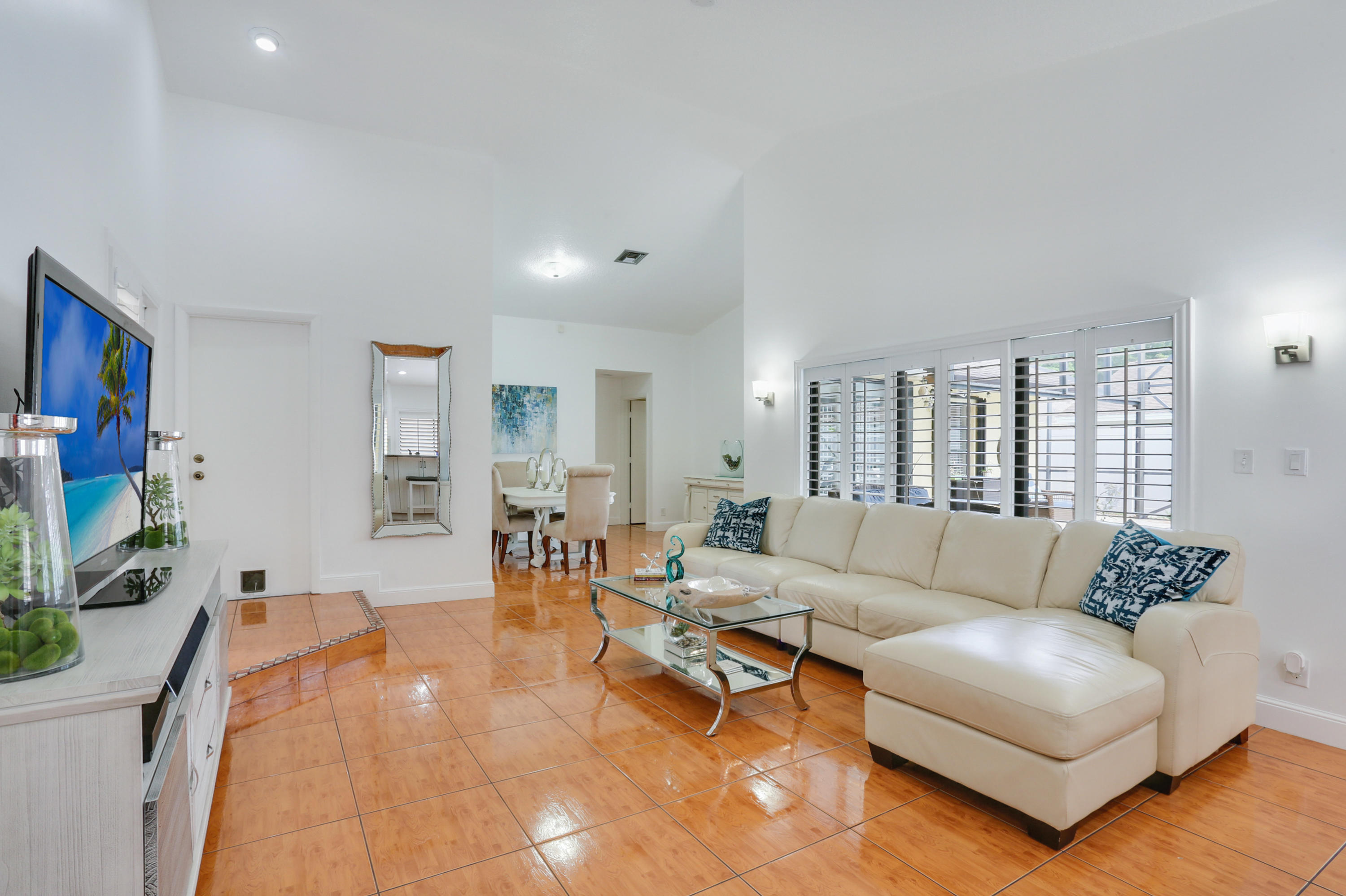 11402 Country Sound Court Boca Raton, FL 33428 - Photo 7 of 22 a living room with furniture and a flat screen tv