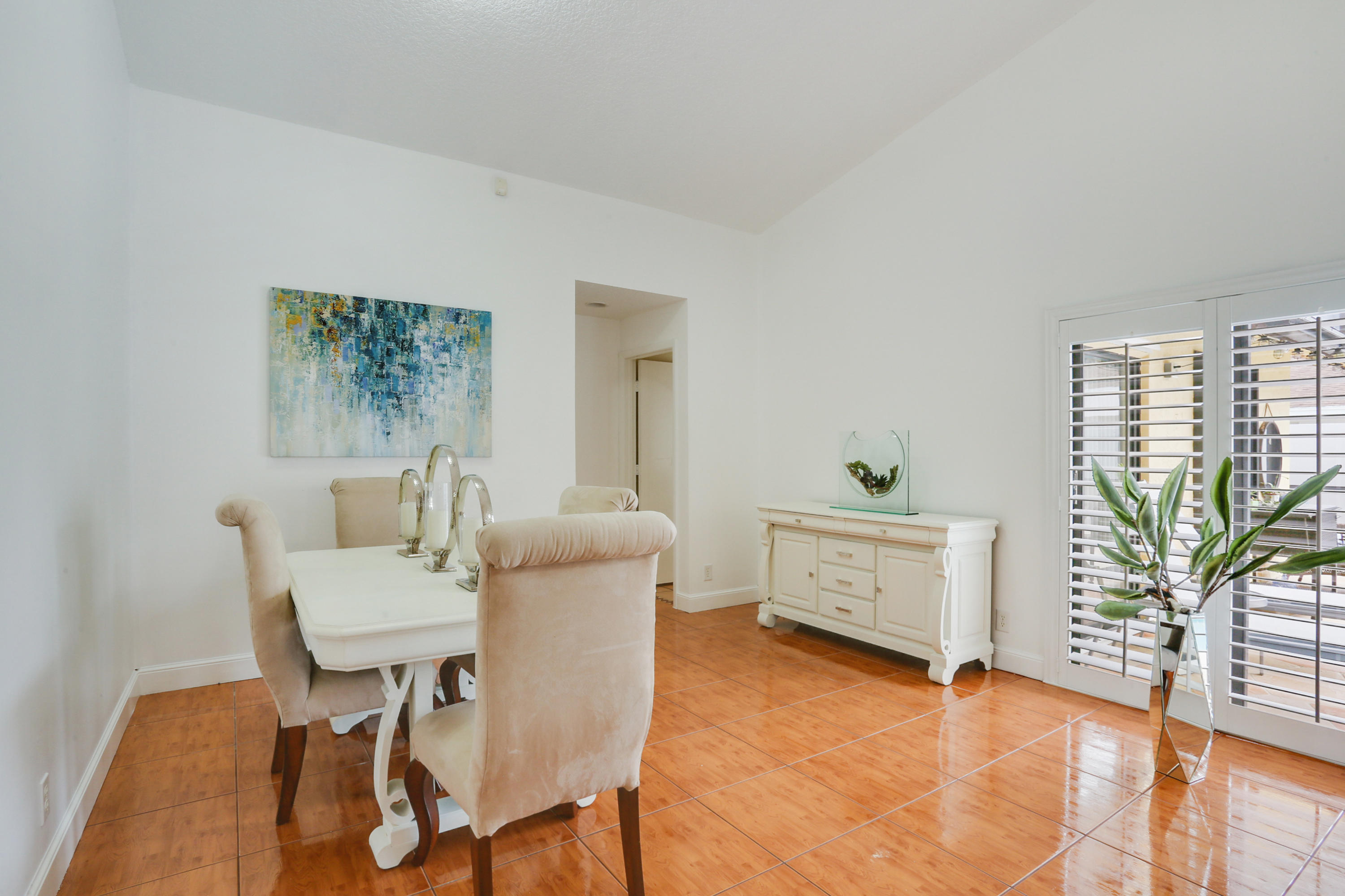 11402 Country Sound Court Boca Raton, FL 33428 - Photo 8 of 22 a living room with furniture and a potted plant