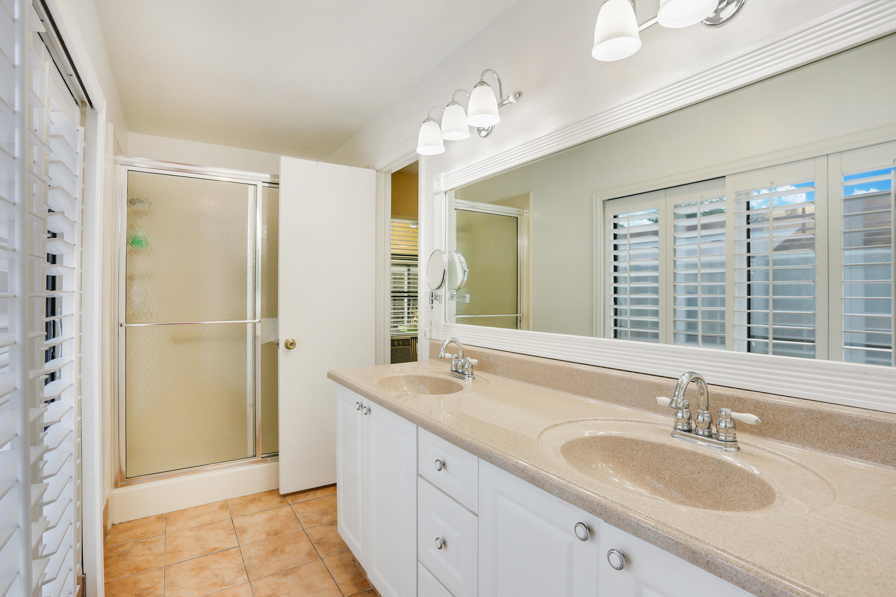 11402 Country Sound Court Boca Raton, FL 33428 - Photo 10 of 22 a bathroom with a granite countertop sink and a mirror