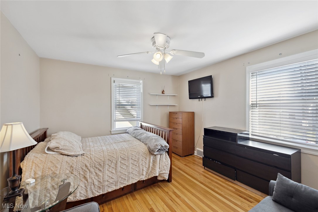 1444 Gordon Road Lyndhurst, OH 44124 - Photo 19 of 33 Bedroom featuring light hardwood / wood-style flooring and ceiling fan