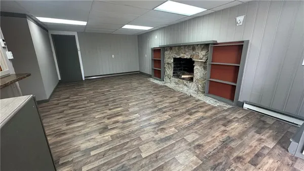 a view of a livingroom with furniture and a fireplace