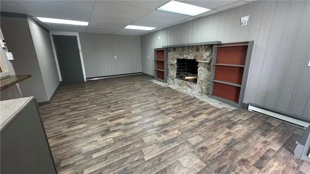 a view of a livingroom with furniture and a fireplace