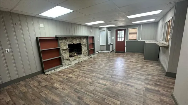 an empty room with wooden floor