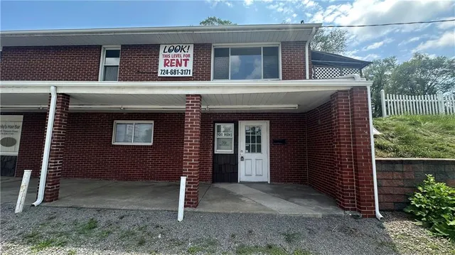 a view of a house with a door and a window