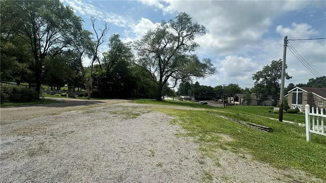 a view of outdoor space with deck and yard