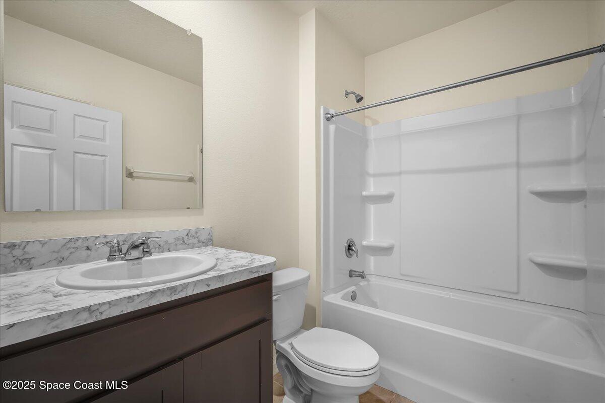 1841 Saxton Road Cocoa, FL 32926 - Photo 12 of 45 a bathroom with a granite countertop sink toilet and shower