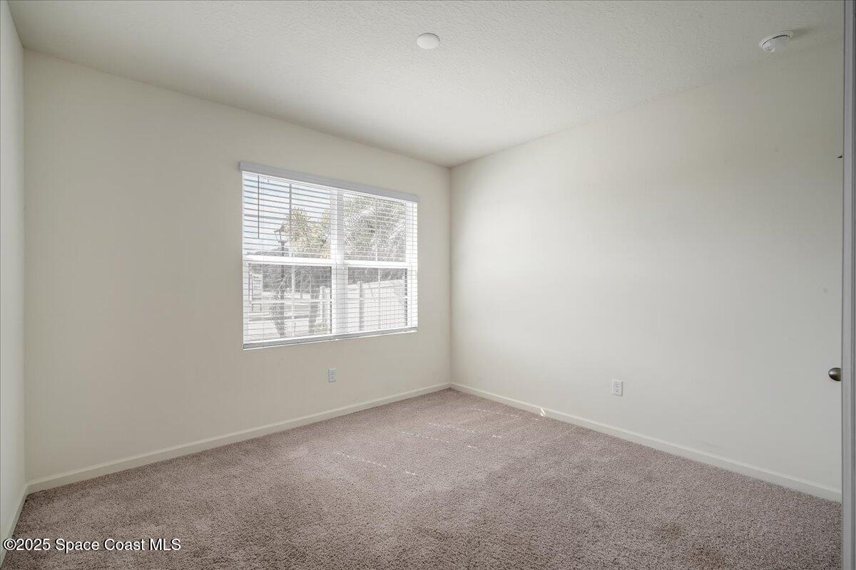 1841 Saxton Road Cocoa, FL 32926 - Photo 13 of 45 an empty room with a window