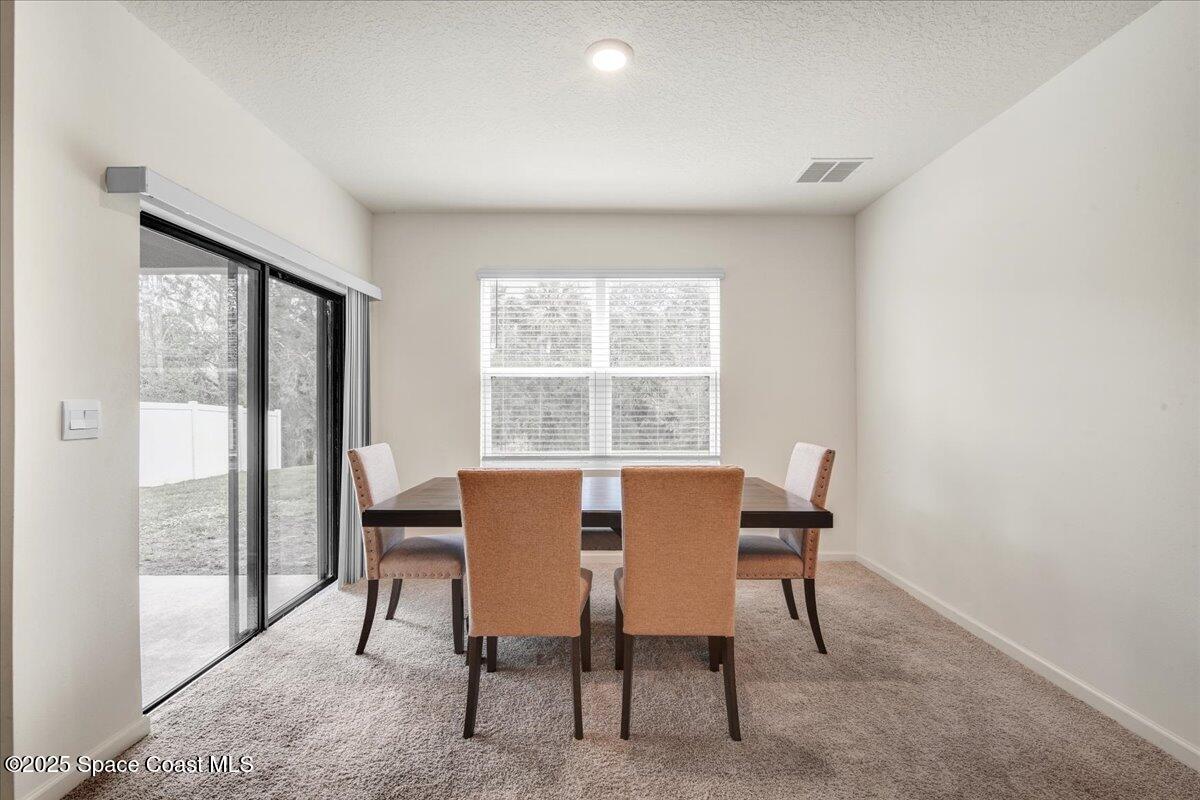 1841 Saxton Road Cocoa, FL 32926 - Photo 17 of 45 a view of a dining room with furniture window and outside view