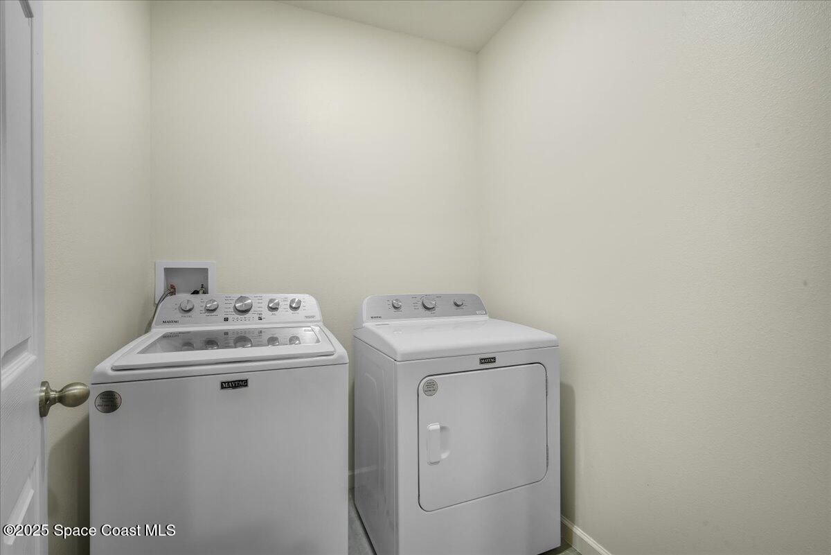 1841 Saxton Road Cocoa, FL 32926 - Photo 29 of 45 a utility room with dryer and washer