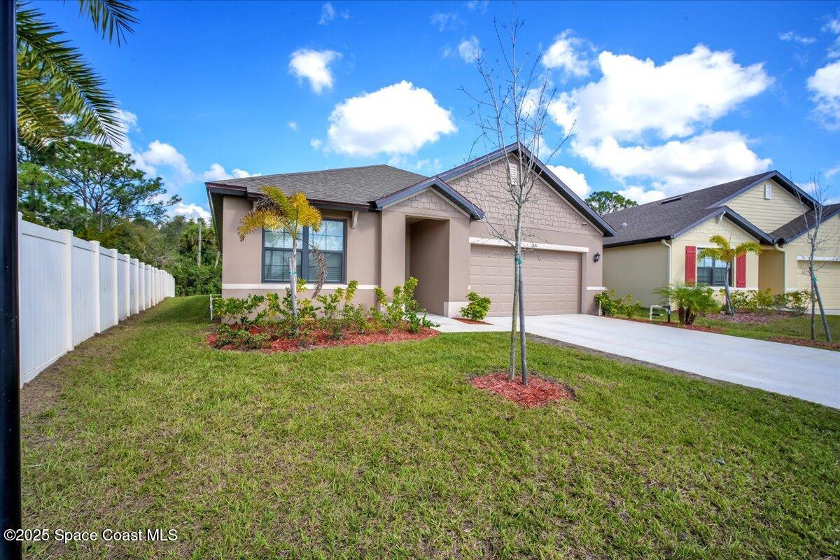 1841 Saxton Road Cocoa, FL 32926 - Photo 3 of 45 a house view with a garden space