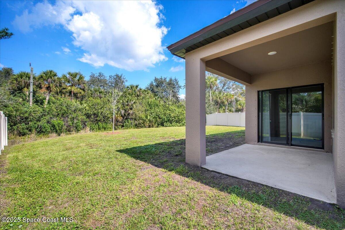 1841 Saxton Road Cocoa, FL 32926 - Photo 32 of 45 a view of a backyard with garden