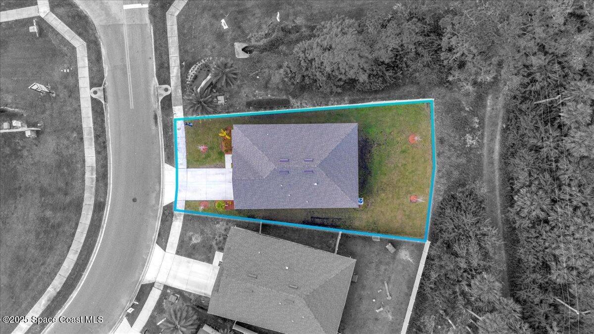 1841 Saxton Road Cocoa, FL 32926 - Photo 35 of 45 an aerial view of a house with a yard