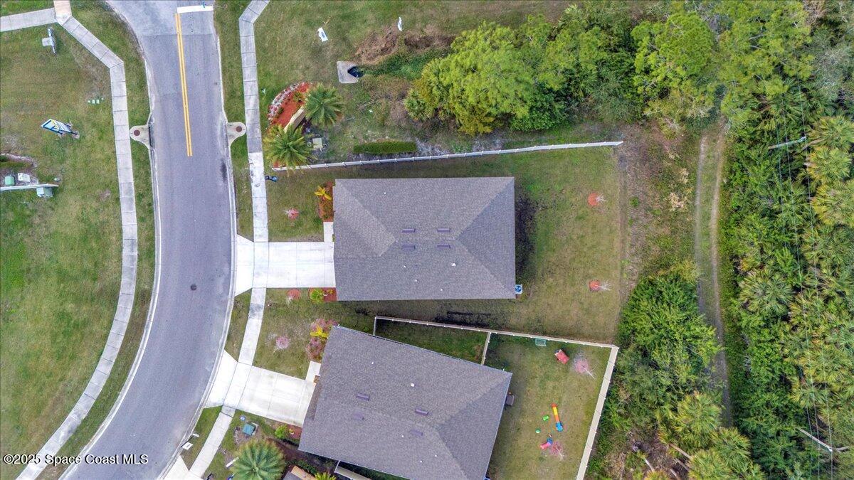 1841 Saxton Road Cocoa, FL 32926 - Photo 36 of 45 an aerial view of a house with a yard