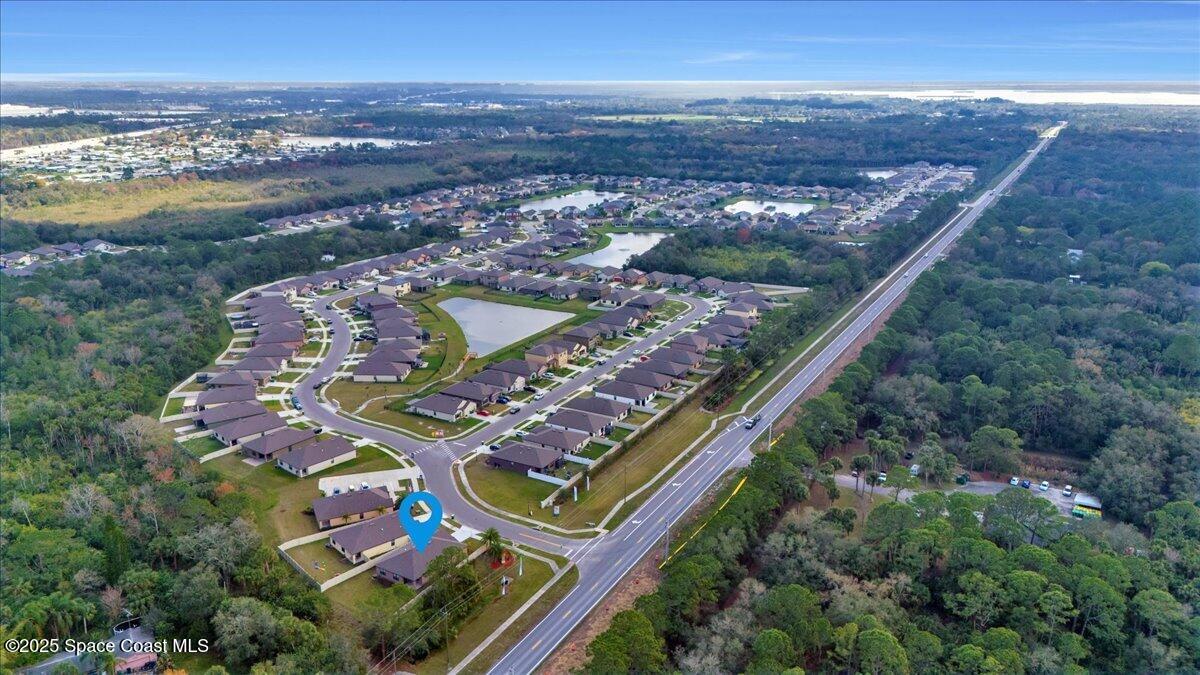 1841 Saxton Road Cocoa, FL 32926 - Photo 39 of 45 an aerial view of a residential houses with outdoor space and ocean view