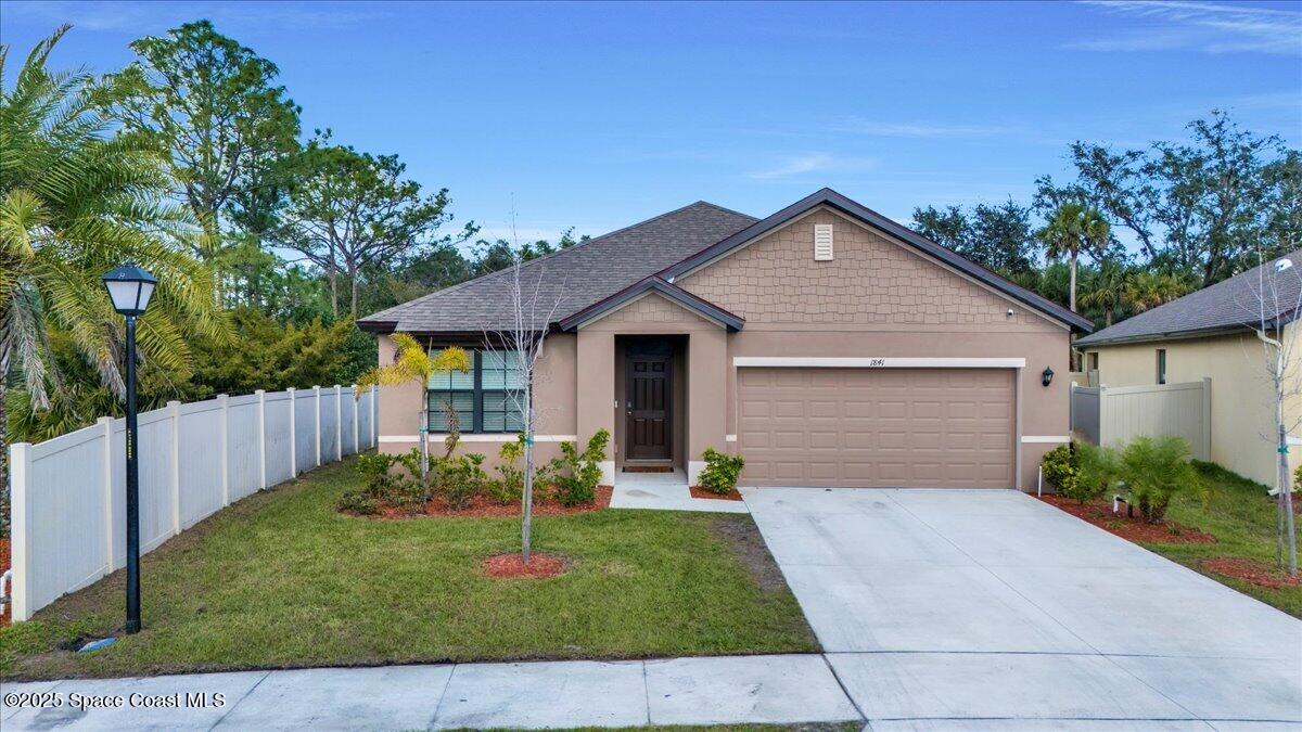 1841 Saxton Road Cocoa, FL 32926 - Photo 40 of 45 a front view of house with yard and green space