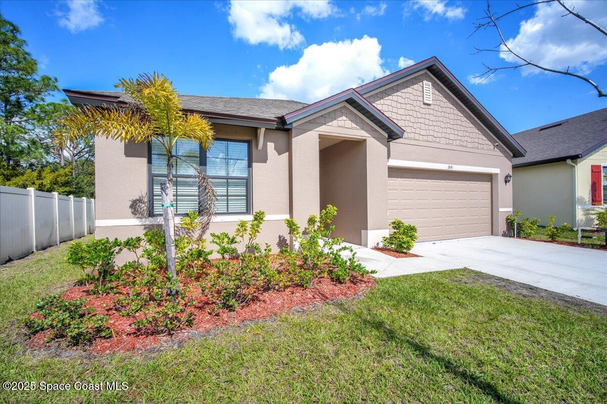 1841 Saxton Road Cocoa, FL 32926 - Photo 4 of 45 a front view of a house with a yard
