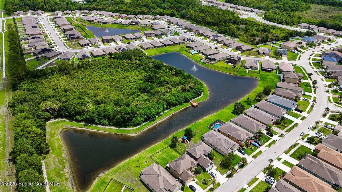 1841 Saxton Road Cocoa, FL 32926 - Photo 44 of 45 an aerial view of a house with a garden