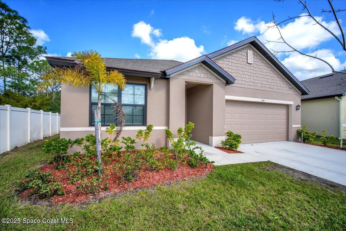1841 Saxton Road Cocoa, FL 32926 - Photo 5 of 45 a front view of a house with a yard