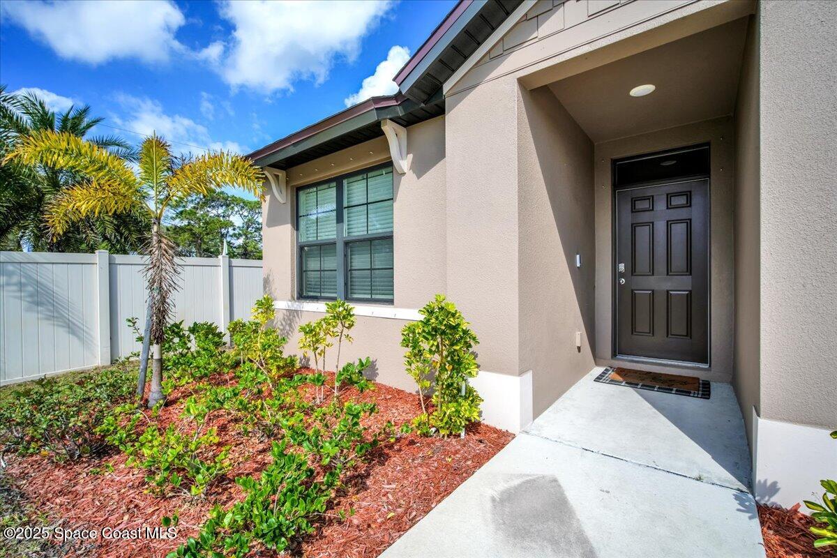 1841 Saxton Road Cocoa, FL 32926 - Photo 6 of 45 a front view of a house with a yard