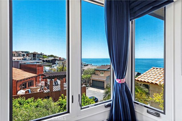 a view of a balcony with furniture